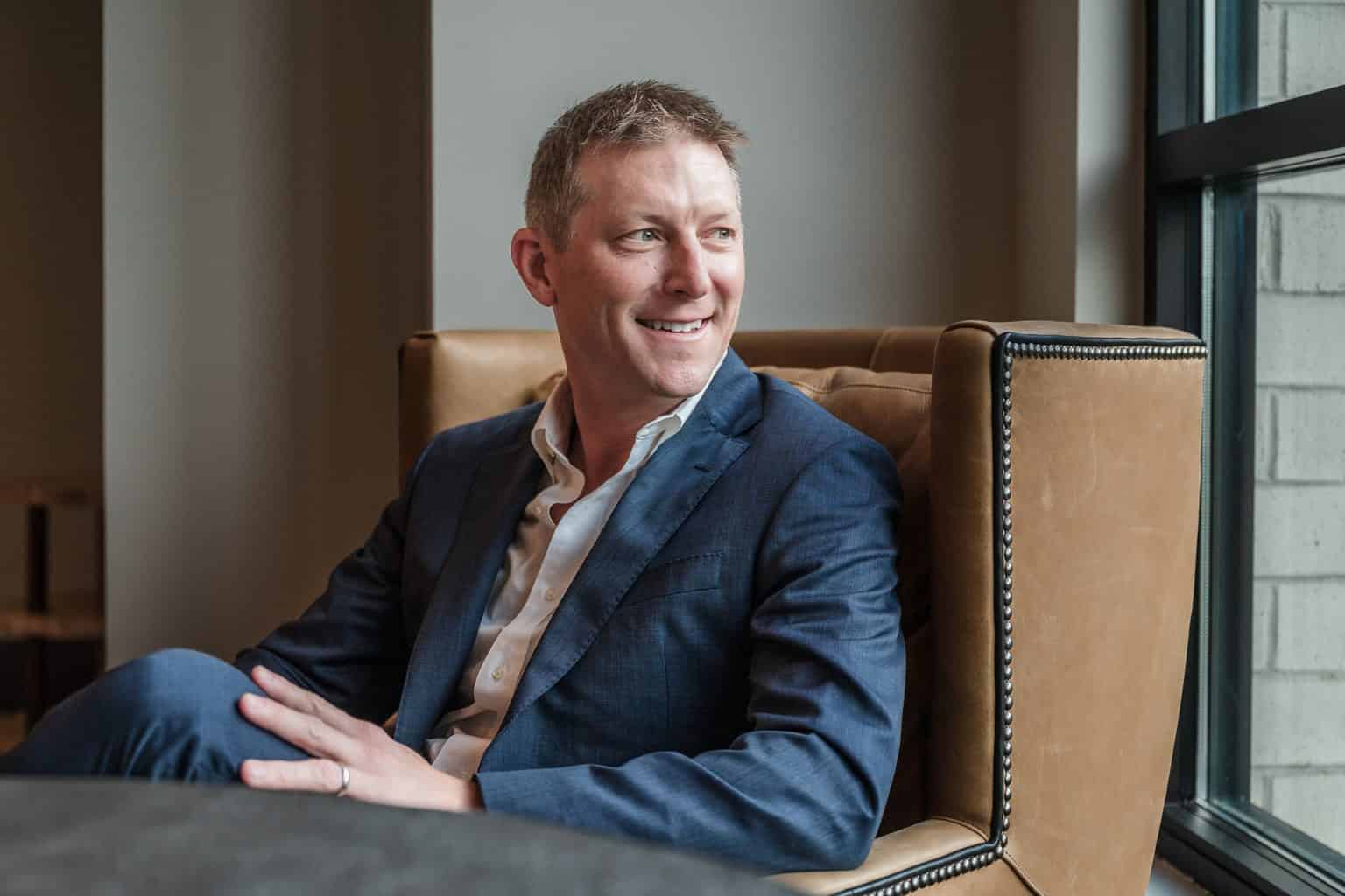 RL Hesson, Franklin, TN mortgage broker, seated in a leather chair